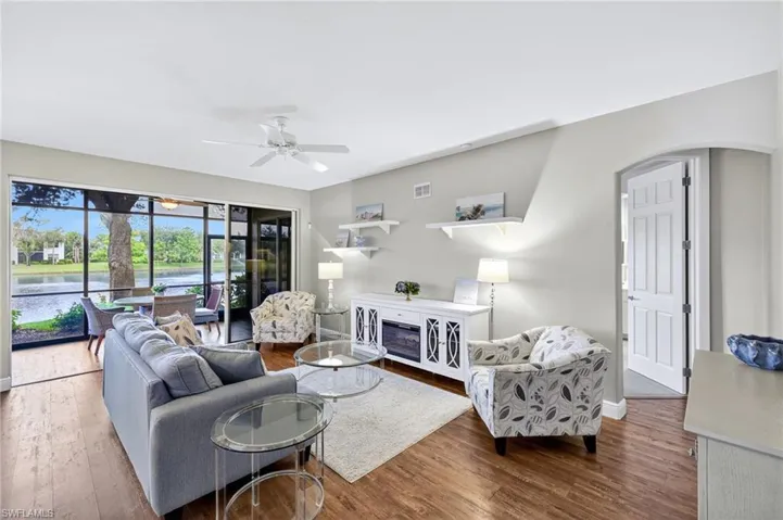 Living room with luxury vinyl floor and view of the lake.
