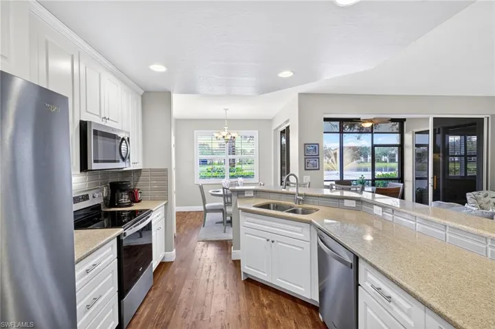 Updated kitchen with stainless appliances and granite counters.