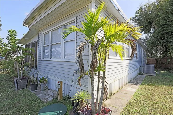 View of home's exterior featuring a cooling unit