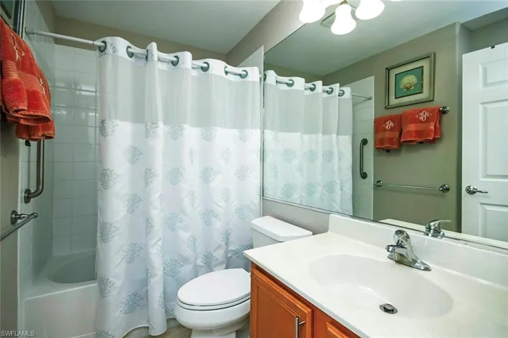 Bathroom with vanity and shower / bath combo