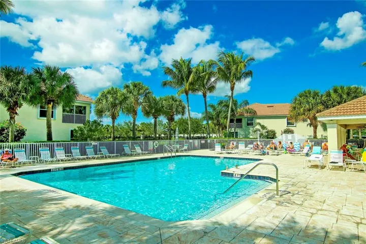Community pool with a patio area