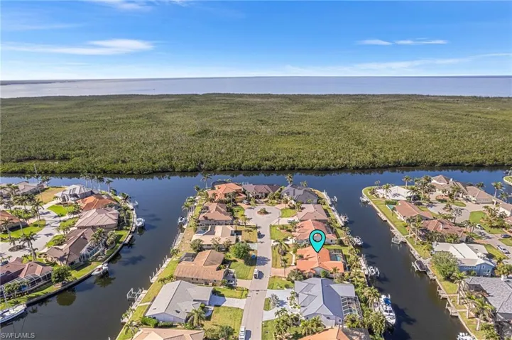 Drone / aerial view with a water view and a residential view