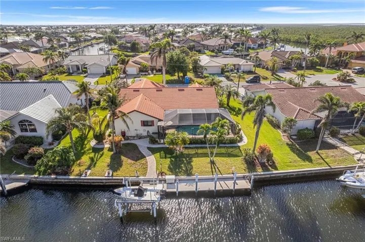 Aerial view featuring a residential view and a water view