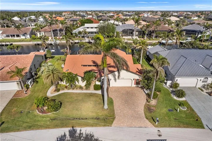 Aerial view featuring a residential view and a water view