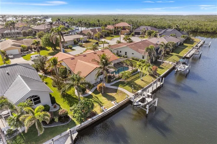 Aerial view featuring a residential view and a water view