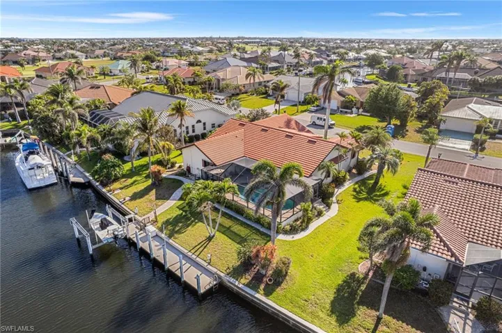 Drone / aerial view featuring a water view and a residential view