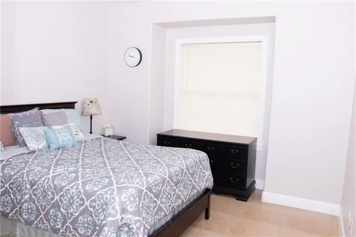 Bedroom featuring light tile patterned flooring