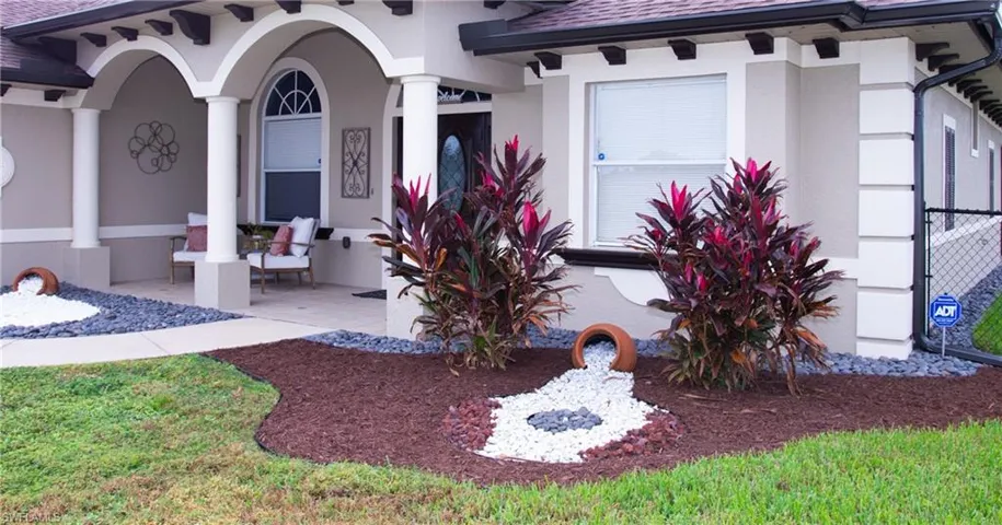 Property entrance featuring a patio area
