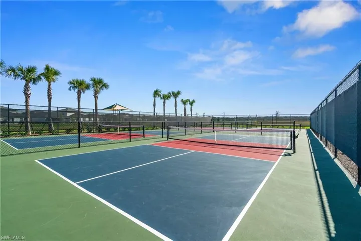 View of tennis court featuring community basketball court