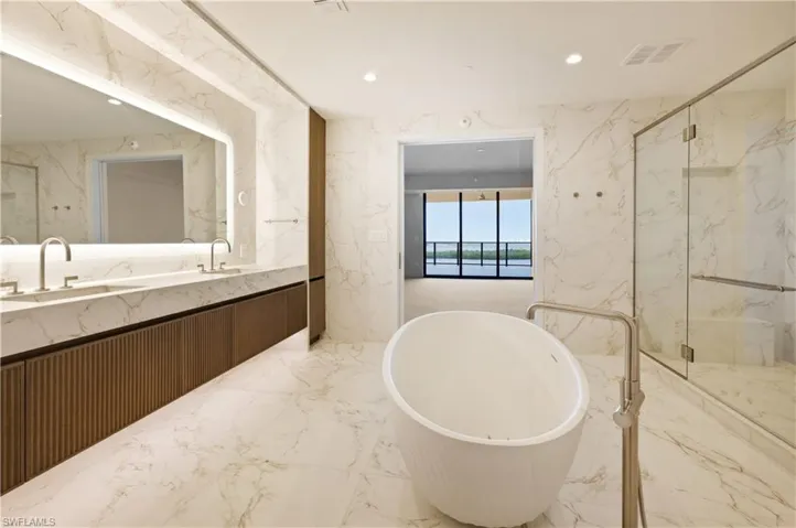 Imagine relaxing in this soaking tub with this water view...