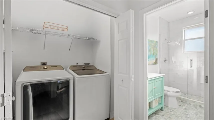 Laundry room featuring separate washer and dryer