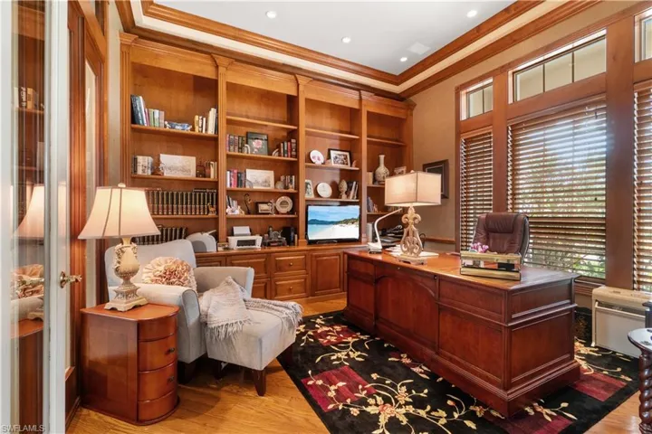 Detailed woodworking and craftsmanship in this spacious den