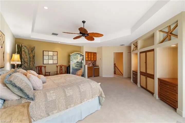 Built in cabinets for more storage and a refrigerator and sink for morning coffee