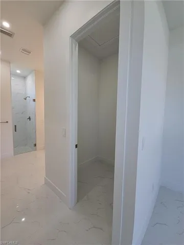 Corridor featuring tile patterned flooring