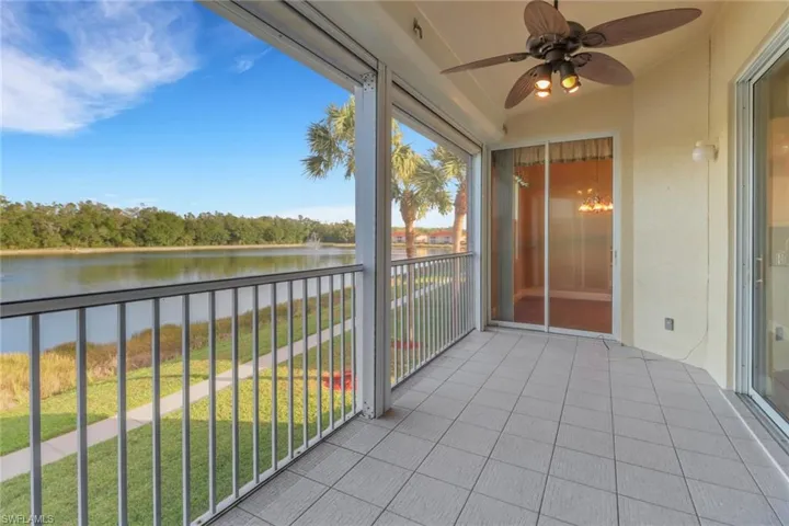 Sunroom  featuring a water view