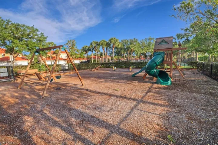 Community play area featuring fence