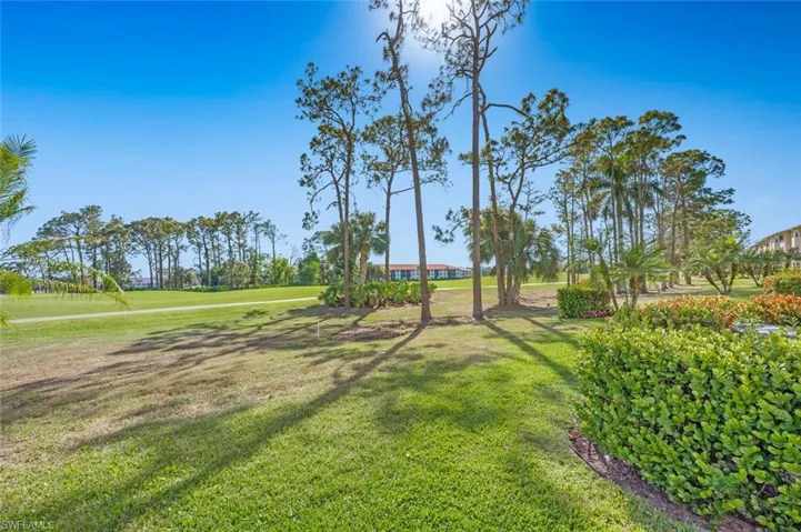 Landscaped back yard, golf course, and cart path