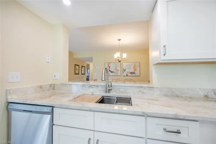 Chef's Sink with Cutting Board, Vegetable Strainer, Folding Drying Rack, Moen Garbage Disposal and brushed nickel hardware throughout