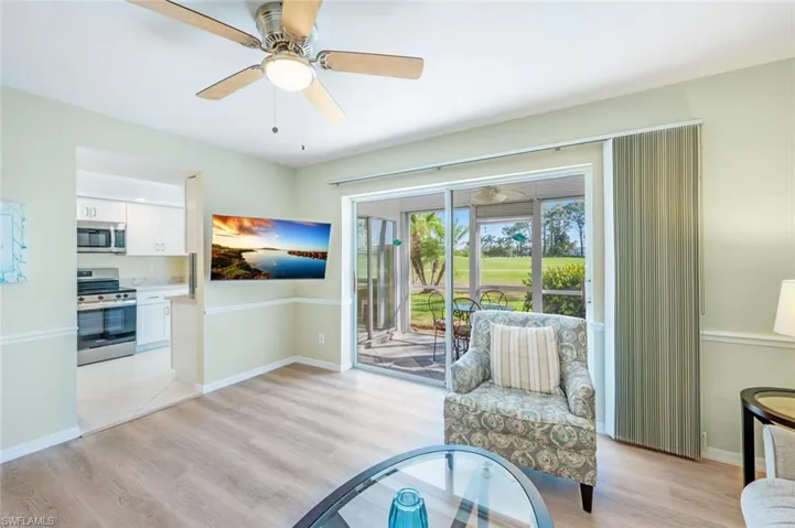 Living Room with Chair Rail and LVP Flooring!  Light, Bright and Airy Just Waiting for You!!