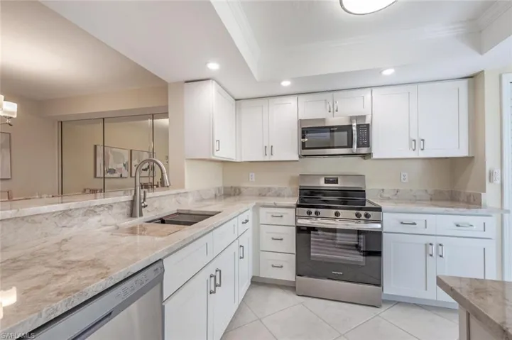Taj Mahal Quartzite Countertop, New Cabinetry with Dovetail Drawers, and New Stainless Steel Appliances