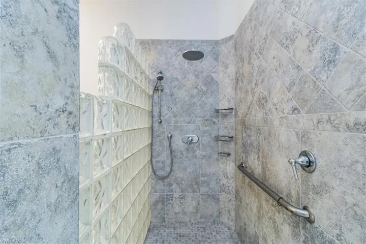 Bathroom featuring a tile shower