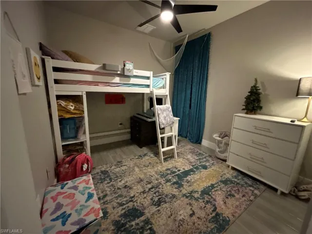 Bedroom featuring light wood finished looking floors and a ceiling fan