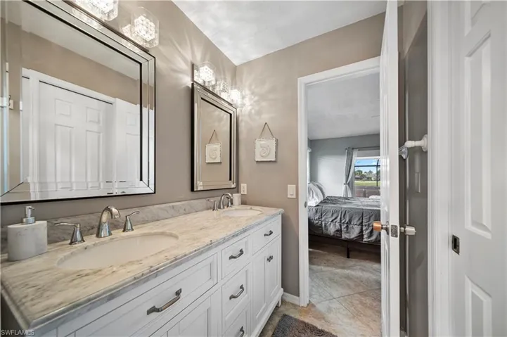 Bathroom featuring vanity and tile patterned floors