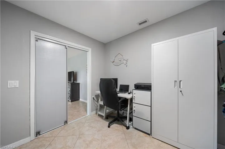 Office space with light tile patterned floors