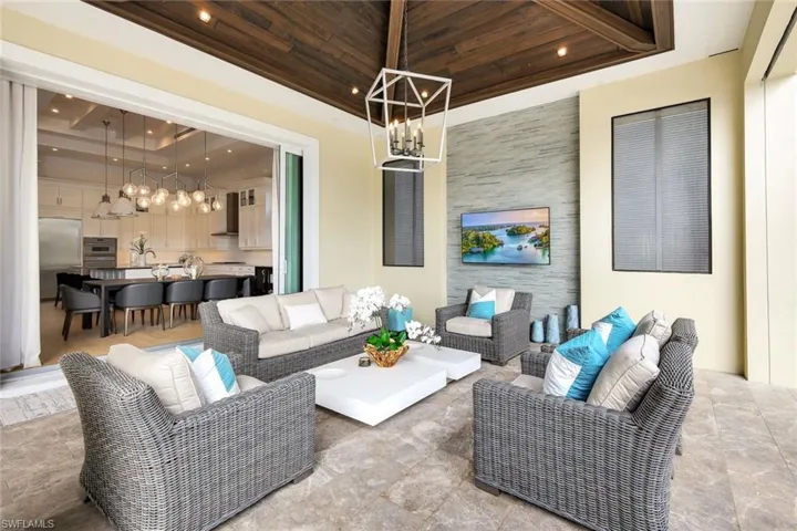 Living room with wood ceiling and a tray ceiling