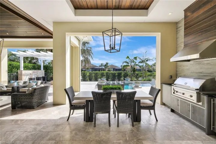View of patio / terrace featuring an outdoor hangout area, a pergola, area for grilling, a swimming pool, and a grill