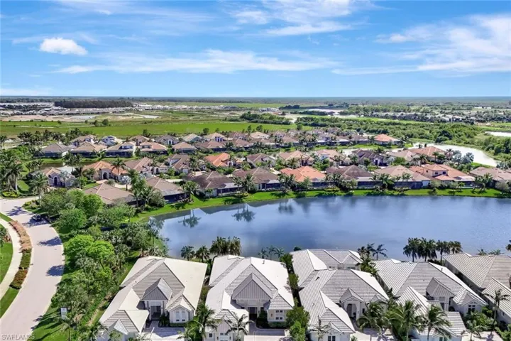 Drone / aerial view featuring a water view House is the second home from the left