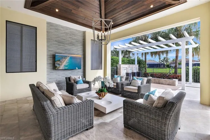 View of patio featuring a pergola and outdoor lounge area