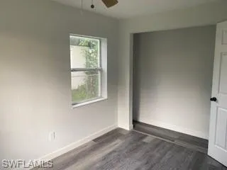 Bedroom featuring luxury vinyl finished floors and a ceiling fan