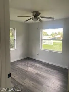 Bedroom with luxury vinyl floors and a ceiling fan