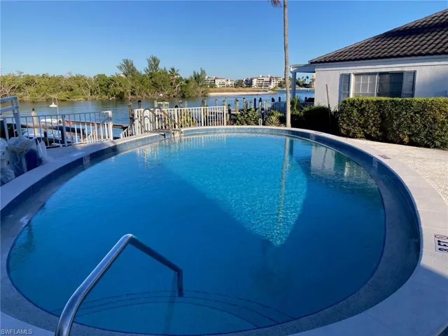 Community pool with a water view