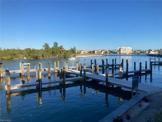 Dock area featuring a water view