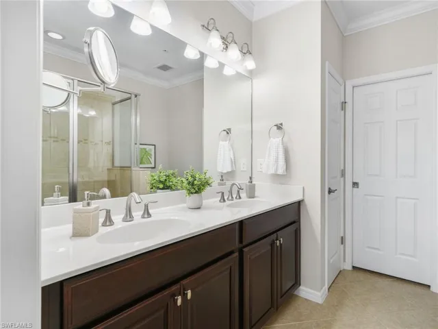 Primary Bathroom with Linen Closet and Walk-In Closet