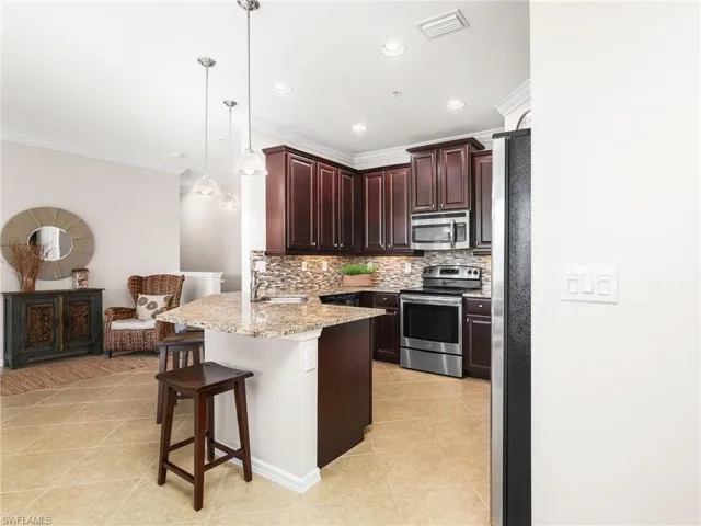 Front Entry and Kitchen with Breakfast Bar
