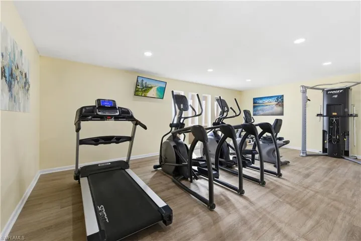 Workout area featuring recessed lighting