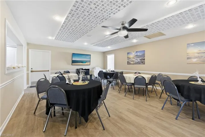 Dining space featuring light wood finished floors, ceiling fan, and recessed lighting