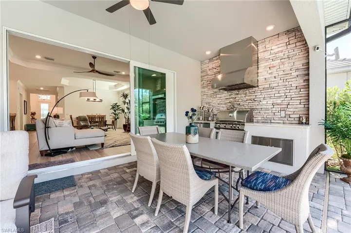 Dining room featuring ceiling fan and dark wood-type flooring