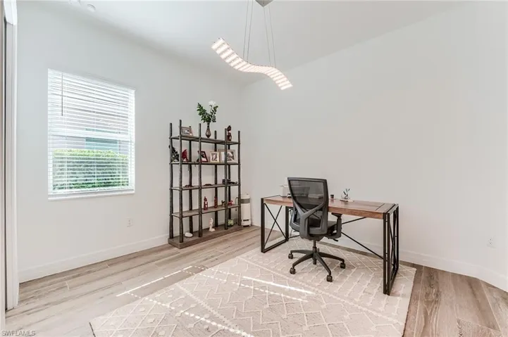 Office space featuring hardwood / wood-style floors