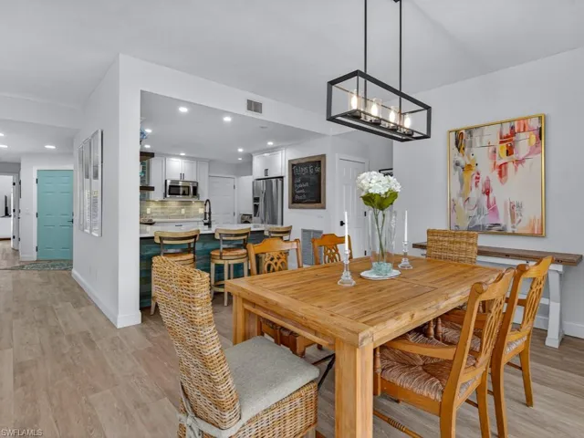 Dining area featuring recessed lighting and light wood-type flooring