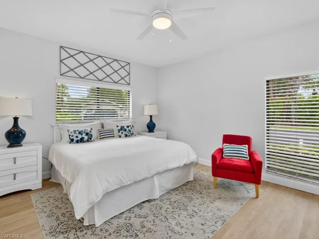 Bedroom featuring light wood-style flooring and a ceiling fan
