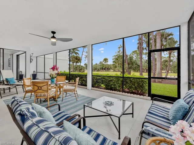Sunroom with an outdoor living space, a ceiling fan, and plenty of natural light