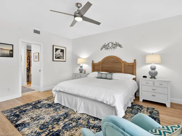 Bedroom with light wood-style flooring and ceiling fan