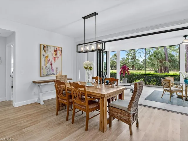 Dining area with light wood-type flooring