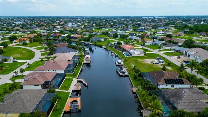 Aerial perspective showcasing a residential area with canal access