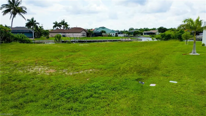 Expansive grassy lot with potential for waterfront access