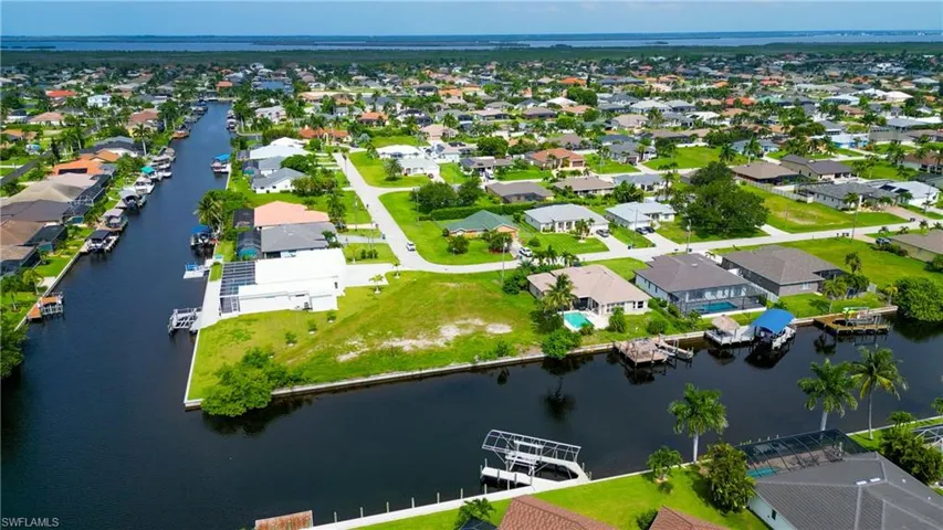 Aerial perspective featuring waterfront properties with direct canal access